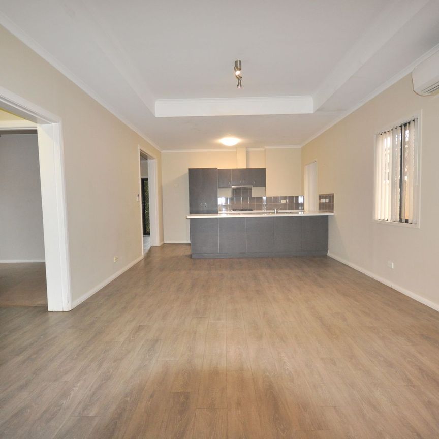 Modern Family Living with Theatre Room, Spacious Yard & Premium Location - Photo 1