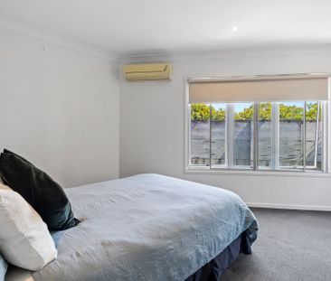 Bright and Airy Two-Bedroom Townhouse in Prime Location - Photo 4