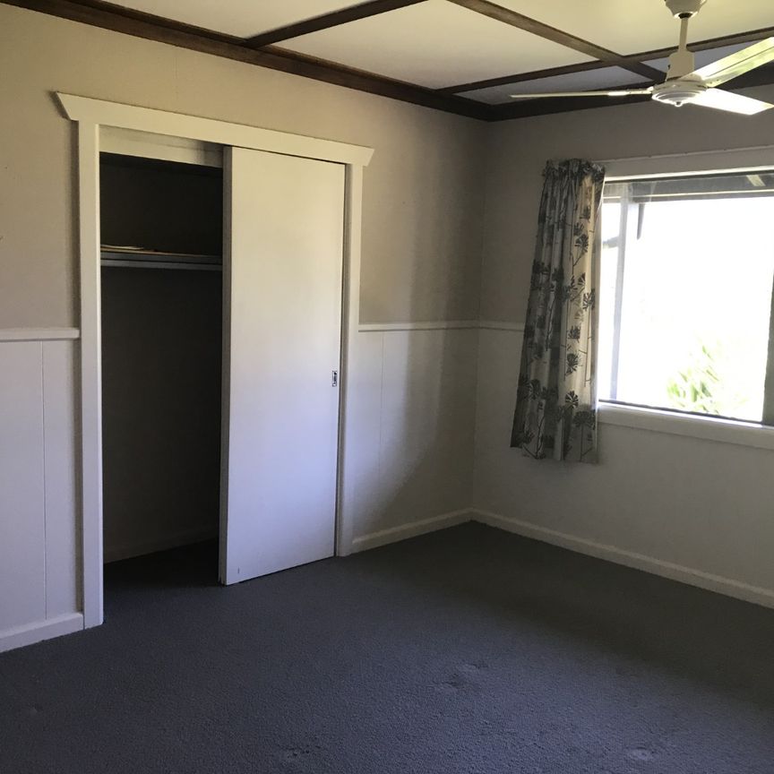 This is a neat and tidy, two bedroom unit at the front of the property, it has open plan kitchen, dining and living with double doors that open out to the deck, a bedroom off either side of the lounge, and the bathroom with shower, toilet and vanity. - Photo 1