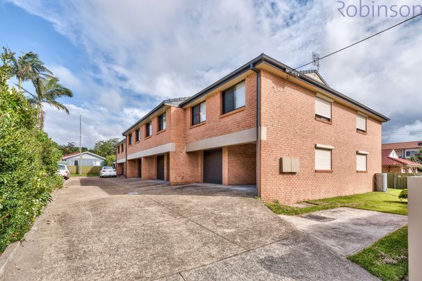 Spacious townhouse with parking for two vehicles. - Photo 1