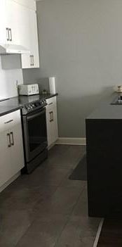 5 1/2 condo locatif - rez de chaussée - Photo 1