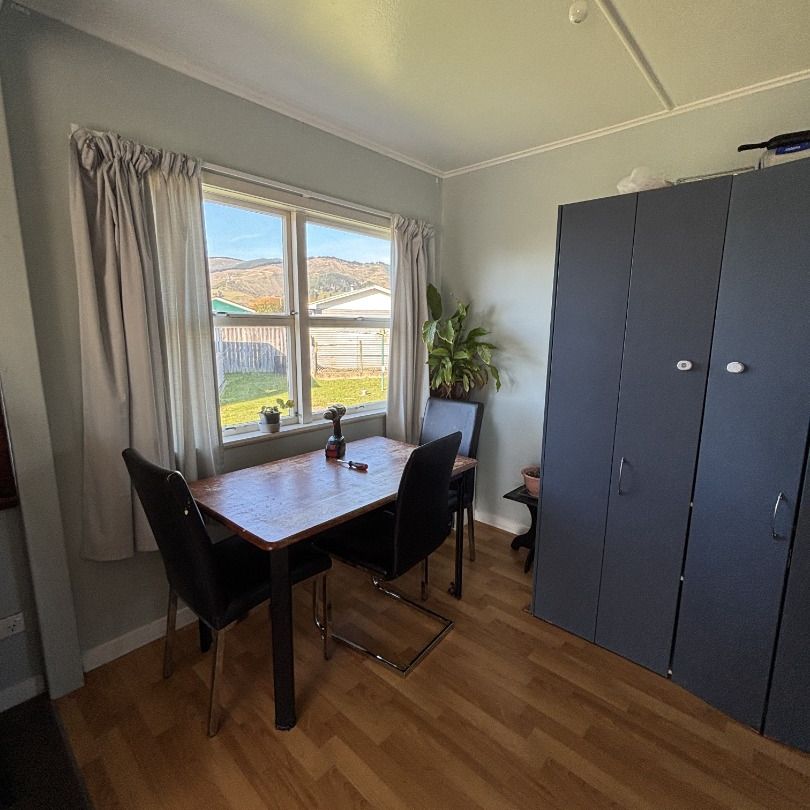 Sunny Family Home with Large Fully Fenced Section - Photo 1
