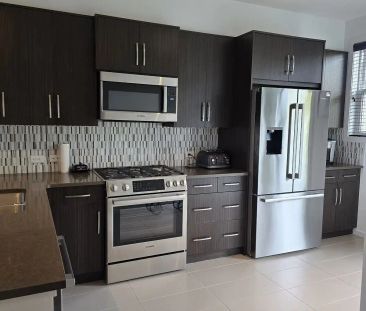 Fully Furnished Luxury Townhouse in Aspen Woods – Just Bring Your S... - Photo 1