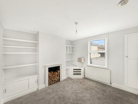 Situated along the High Street, this charming 3 bedroom character home offers a private entrance via a side passage that also provides access to the attractive south/west-facing garden. - Photo 2