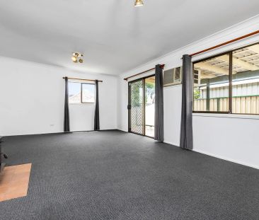 Neat Three Bedroom Home in Ideal Location - Photo 1