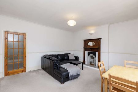 Attractive period conversion property with charm and character located on a popular, tree-lined street. - Photo 2
