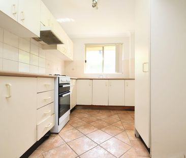 Spacious Top-Floor Two-Bedroom Unit in a Convenient Location - Photo 4