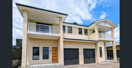 Coming Soon - Brand New Stylish 4-Bedroom Duplex with Lake Views - Photo 3