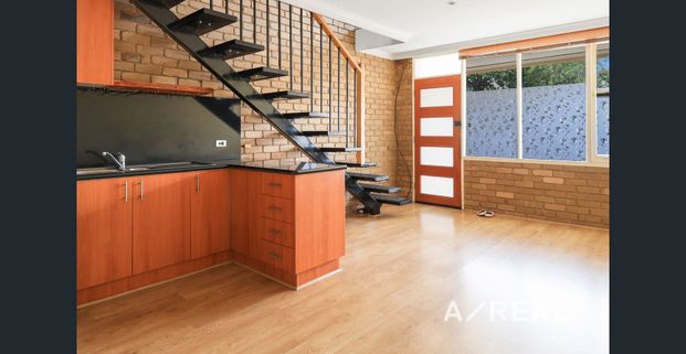 Double Storey Living with Private Courtyard - Photo 1