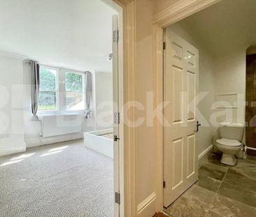 Spread over the ground floor of this stunning period building - Photo 5