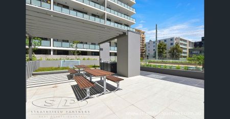 Stylish 2-Bedroom Apartment with Resort-Style Living - Photo 2