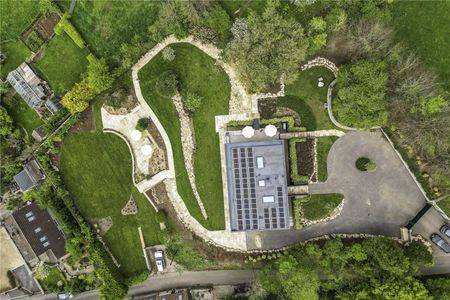 An exceptional contemporary home with quality interiors and landscaped gardens in an elevated position with village and open country views. - Photo 5