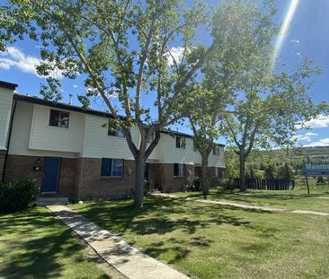 Bow River Townhomes | 6347 Bowview Road NW, Calgary - Photo 1