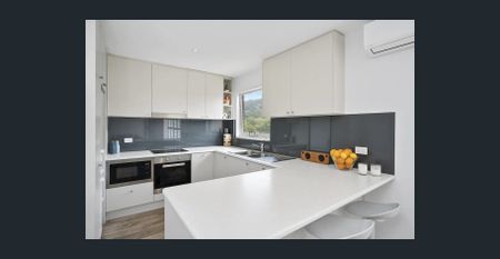 Sunny Top Floor Living Right in the Heart of Newport - Photo 2