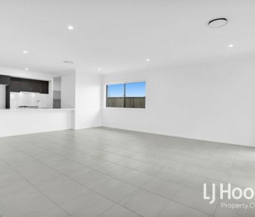 STUNNING FAMILY HOME IN FLAGSTONE WITH DUCTED AIR + QUALITY FINISHES! - Photo 4