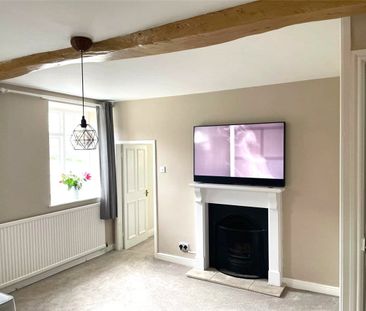 Available mid-April, we offer to you 21 Main Street, a delightful t... - Photo 2