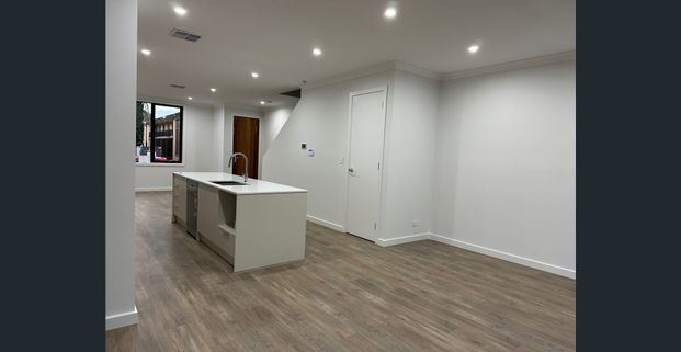 Brand New Modern 3-Bedroom Townhouse with City & Beach at Your Doorstep! - Photo 1