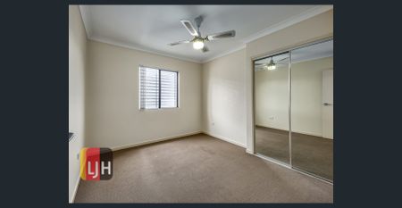 TOP FLOOR THREE BEDROOM UNIT WITH DOUBLE GARAGE & LARGE DECK! - Photo 3