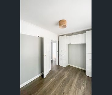 Comfortable Three-Bedroom Home in a Convenient Location - Photo 1