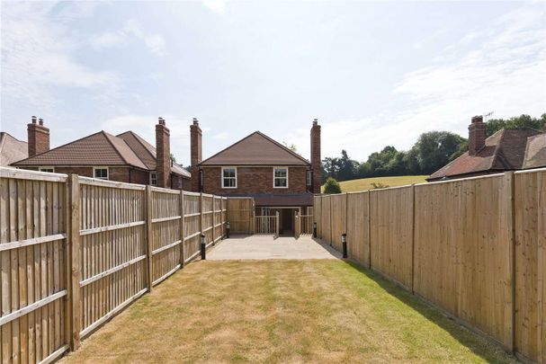 A stunning four bedroom semi-detached house set across three floors offering excellent family accommodation with a good amount of outside space. - Photo 1