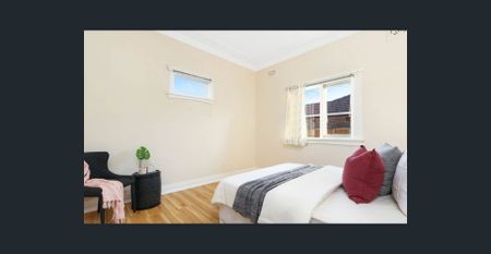 Unfurnished floorboard throughout living room and bedrooms | Laundry room with toilet | Study area - Photo 2