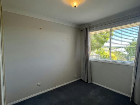 Bright Family Home with Sunroom and Outdoor Living Space - Photo 5