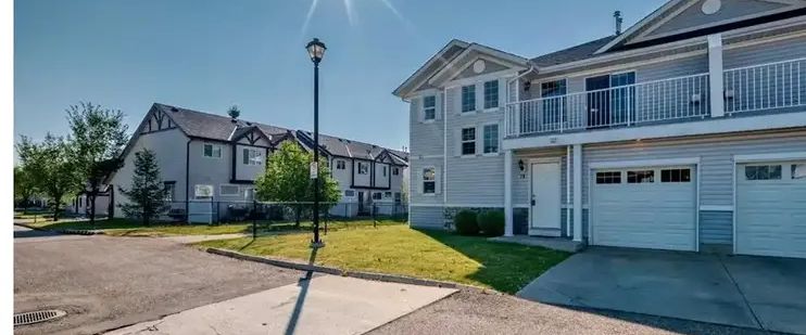 Spacious 3 bedroom townhouse with attached single garage. Close to all amenities | 79 Country Village Circle Northeast, Calgary - Photo 1