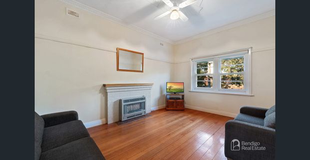 COMFORTABLE TWO-BEDROOM HOME WITH VERSATILE RUMPUS ROOM - Photo 1