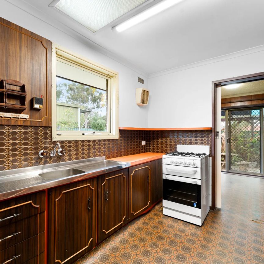 Perfectly Positioned 2-Bed Home with Entertaining Area - Photo 1