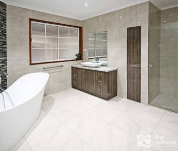 Sitting Amongst the Flowers - Photo 1