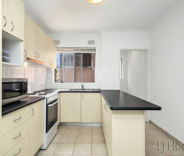 BRIGHT & SUNNY RENOVATED TWO BEDROOM UNIT - Photo 2