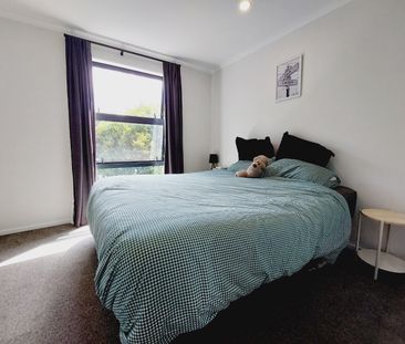 Stylish 2-Bedroom Home with Modern Comforts & Private Outdoor Spaces - Photo 2
