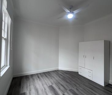 Spacious 3-Bedroom Home with Sunroom and Garden Shed - Photo 5