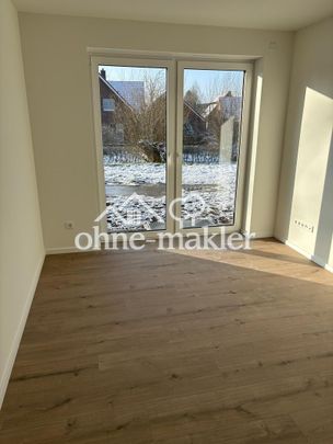 Exklusive Neubauwohnung im Erdgeschoss mit Garten - Foto 1