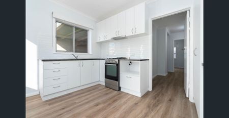 RENOVATED TWO BEDROOM UNIT WITH MODERN COMFORTS - Photo 4