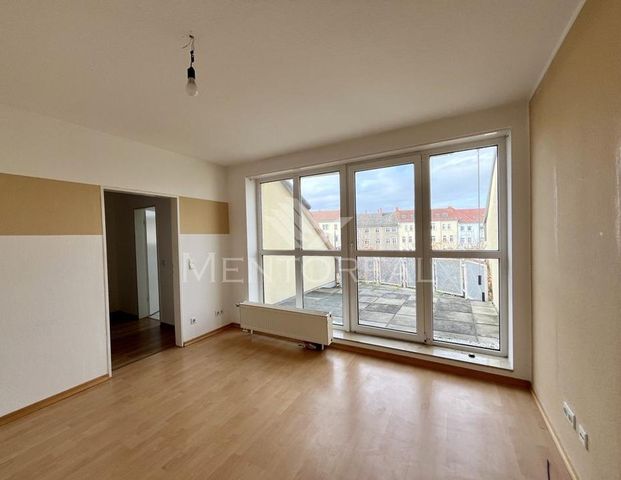 Gemütliche Dachgeschosswohnung mit großer Sonnenterrasse - Foto 1