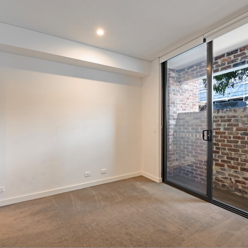 Split-Level I Courtyard Apartment I Lockup Garage - Photo 1