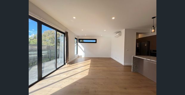 Elegant Townhouse Offering Comfort and Convenience - Photo 1