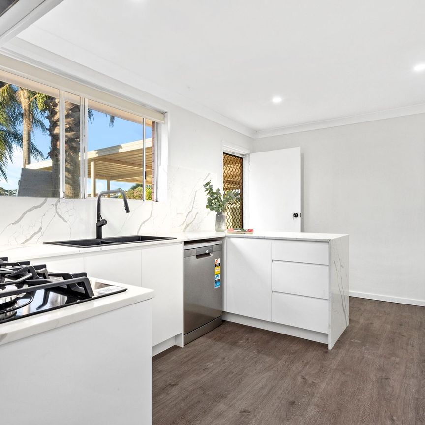 RENOVATED AND READY TO MOVE IN Three Bedroom Residence Close to All Amenities! - Photo 1