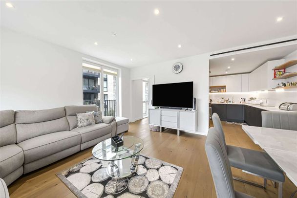 A bright three bedroom apartment in this modern Development - Photo 1