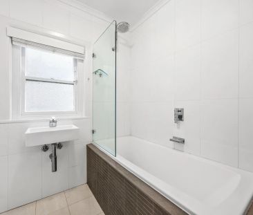 Spacious Two-Bedroom with Sunroom & Character Details - Photo 2