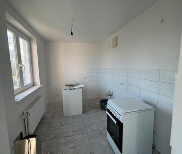 Frisch sanierte 2-Zimmer-Wohnung mit Wintergarten, Tiefgarage und A... - Foto 1