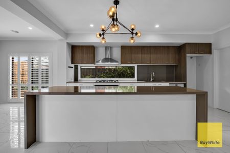Exceptional 5-Bedroom Family Home with Dual Master Suites and Multiple Living Areas - Photo 4