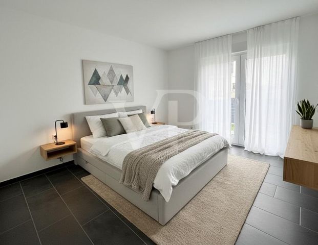 Neuwertige Erdgeschosswohnung mit Terrasse und Tiefgaragenstellplatz - Foto 1