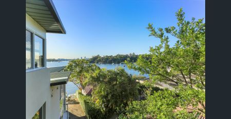 TUCKED AWAY ON THE WATERS EDGE - Photo 4