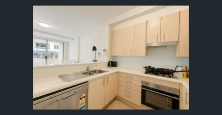 Freshly painted white, modern carpet, secure parking, ultimate blend of city convenience and sophisticated urban living + Pool and Sauna - Photo 5