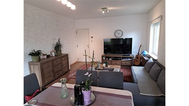 Een appartement op de eerste verdieping met garage en tuintje - Photo 1