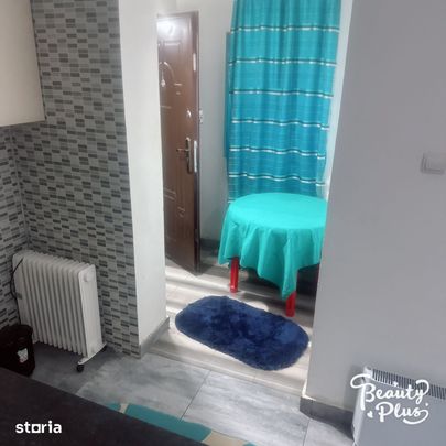 Garsonieră spațioasă cu facilități și grădină - Fotografie 1