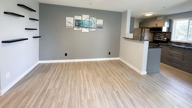 Sunlit 2 Bed Condo With Tree Lined Views | All Utilities Included | Evergreen - Photo 1