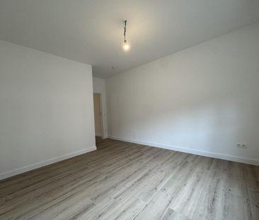 Gerenoveerd gelijkvloers appartement met tuin te huur - Photo 2